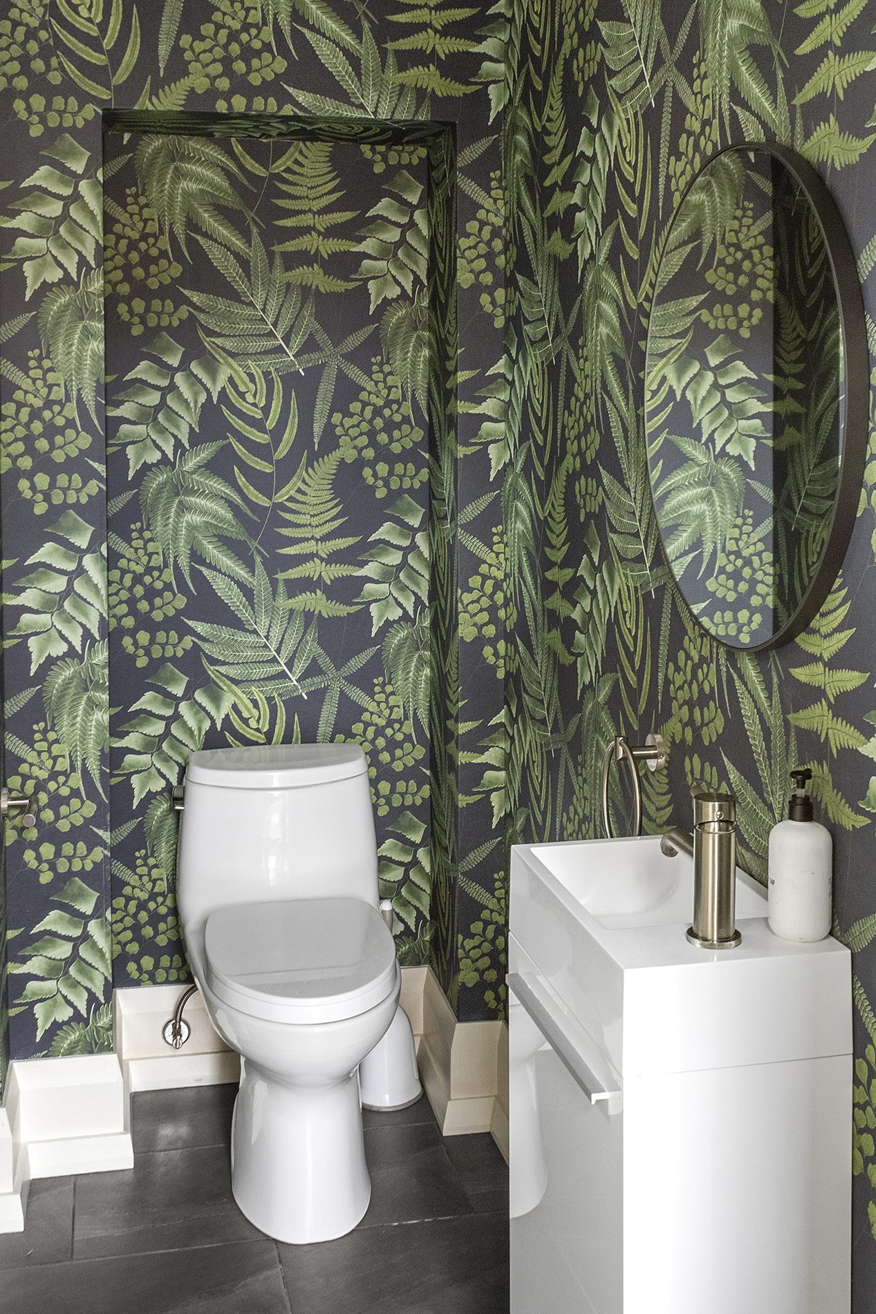 bold green patterned wallpaper in bathroom