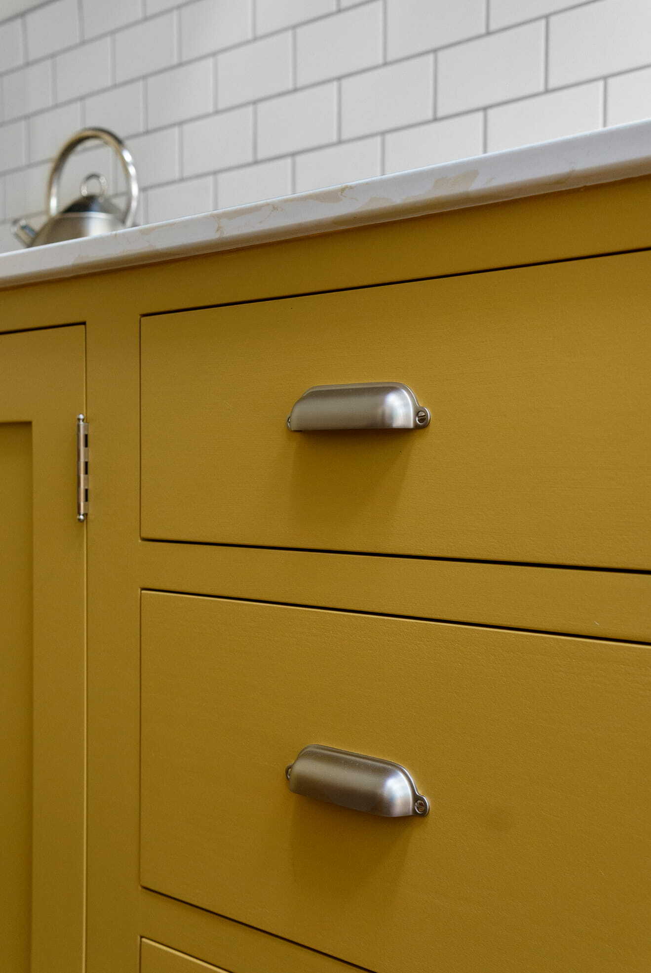 Toronto Kitchen Renovation mustard yellow cabinets with pulls