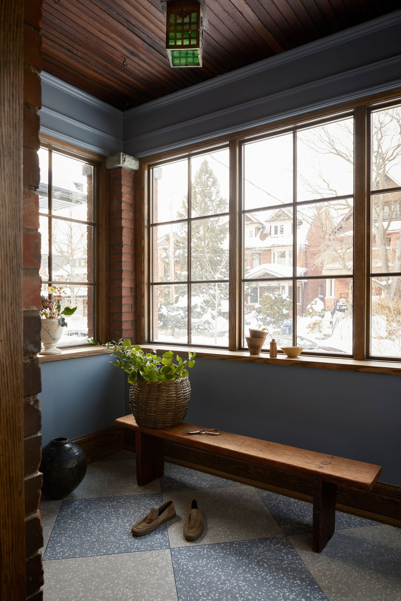 westminster toronto multi-unit renovation with dark walls and explosed brick