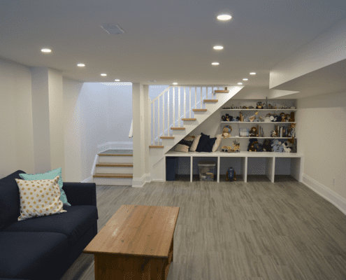 Toronto basement renovation, refreshed layout, stairs and built in shelves