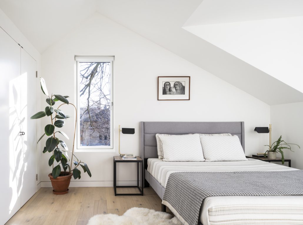 Beautiful laneway house in parkdale, Toronto. Second floor bedroom bed and window